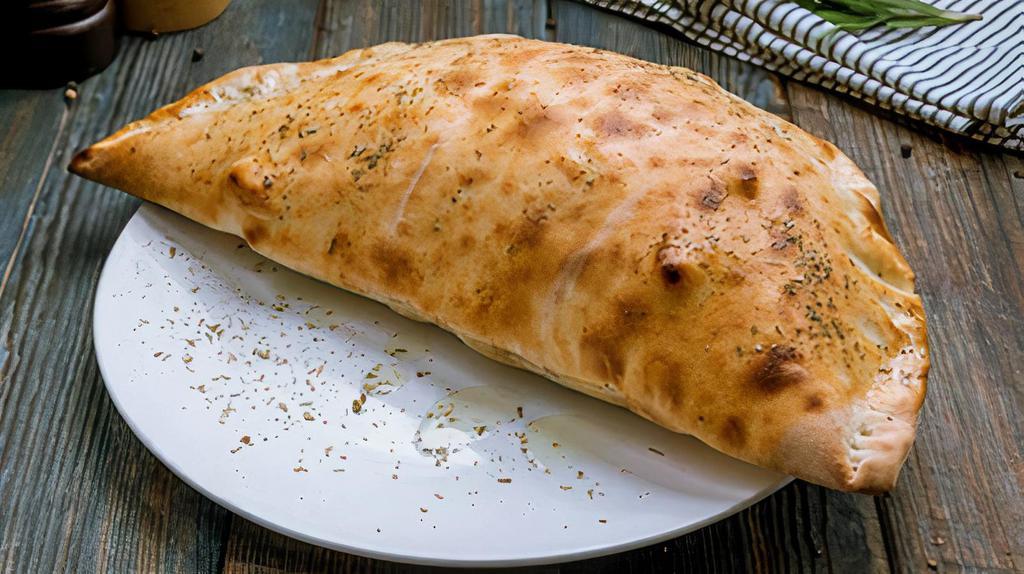 Calzone Deluxe · Pizza sauce, pepperoni, sausage, onions, green peppers, mushrooms and mozzarella.