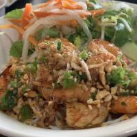 Grilled Shrimp · Grilled Shrimps over a bed of vermicelli noodles. Served on the side are Chopped lettuce, be...