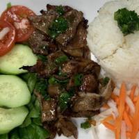 Grilled Pork · Grilled Pork Served with white rice, Lettuce, Cucumbers, Tomatoes, Pickled carrots and Fish ...