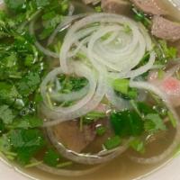 The Pho Special - Phở Đặc Biệt · Eye round steak, Flank steak, Brisket, Meatballs and tendon. Served with cilantro, green oni...