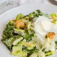 Classic Caesar Salad · Crispy hearts of romaine lettuce with garlic croutons and homemade caesar dressing. Topped w...