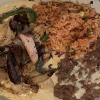 Elsa'S Enchiladas · 3 cheese enchiladas with ranchero sauce. Topped with mixed fajitas. Served with rice and you...