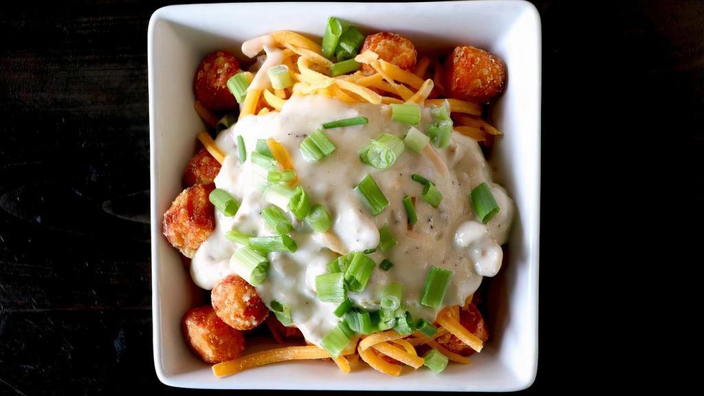 Southern Style-Sweet Potato Tots · house-made sausage gravy, cheddar cheese, green onions