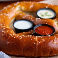 Big Ass Pretzel (Coming Soon) · GIANT PRETZEL~ BUTTERED & SALTED. SERVED WITH QUESO, MUSTARD, AND MARINARA