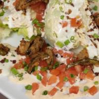 Texas Wedge · ICEBERG WEDGE, CRISPY BACON, TOMATOES, FRIED JALAPEÑOS, BLEU CHEESE CRUMBLES WITH CHIPOTLE D...