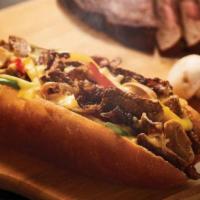 Philly Cheesesteak · Steak slices, onions, bell peppers, mushrooms packed into a seven inch toasted hoagie roll a...