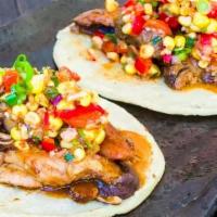 Bbq Berkshire Pork Taco · Roasted corn salsa, grilled onions, and black beans.