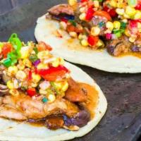 Bbq Berkshire Pork Taco · Roasted corn salsa, grilled onions, and black beans.