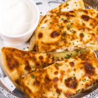 Grilled Chicken Quesadilla · All quesadillas served on a giant 10” tortilla stuffed with
jack cheese and grilled until go...