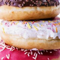 Sprinkle Dozen · Dozen chocolate-dipped donuts with sprinkles. If you would like a different icing flavor (va...