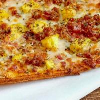 Breakfast Pizza · Thin Cauliflower crust-gluten free with sauce, mozzarella, egg, and seasoning. Add proteins.