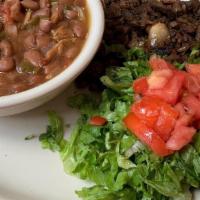 Carne Asada A La Mexicana · Sliced sirloin mixed with onion, tomatoes, and serrano peppers. Includes Spanish rice, refri...