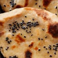 Naan Cheese Naan · White bread stuffed with cheese and baked in tandoor.
