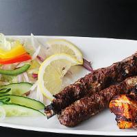 Lamb Seekh Kebab Shish · Minced lamb kebabs infused with ginger, green chilli and cilantro.