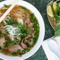Pho Dac Biet · Rice noodle soup with rare eye of round, flank, fatty brisket, tendon, and tripe