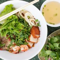 Mi Thap Cam · Egg noodle soup with sliced pork, shrimp, squid, and fish cake (also available dry)