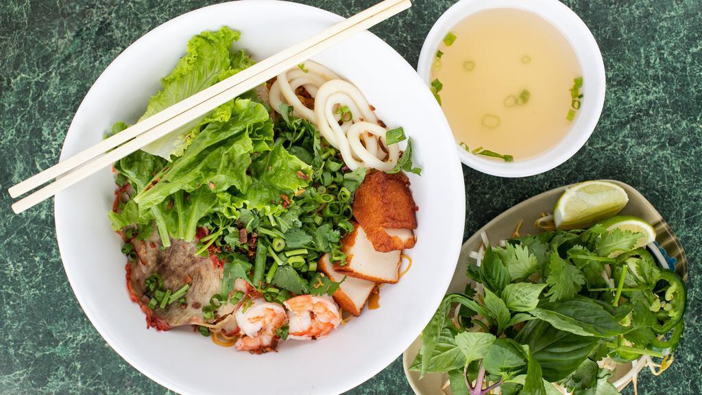 Mi Thap Cam · Egg noodle soup with sliced pork, shrimp, squid, and fish cake (also available dry)