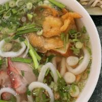 Hu Tieu Thap Cam · Rice noodle soup with sliced bbq pork, shrimp, squid, and fish cake (also available dry)