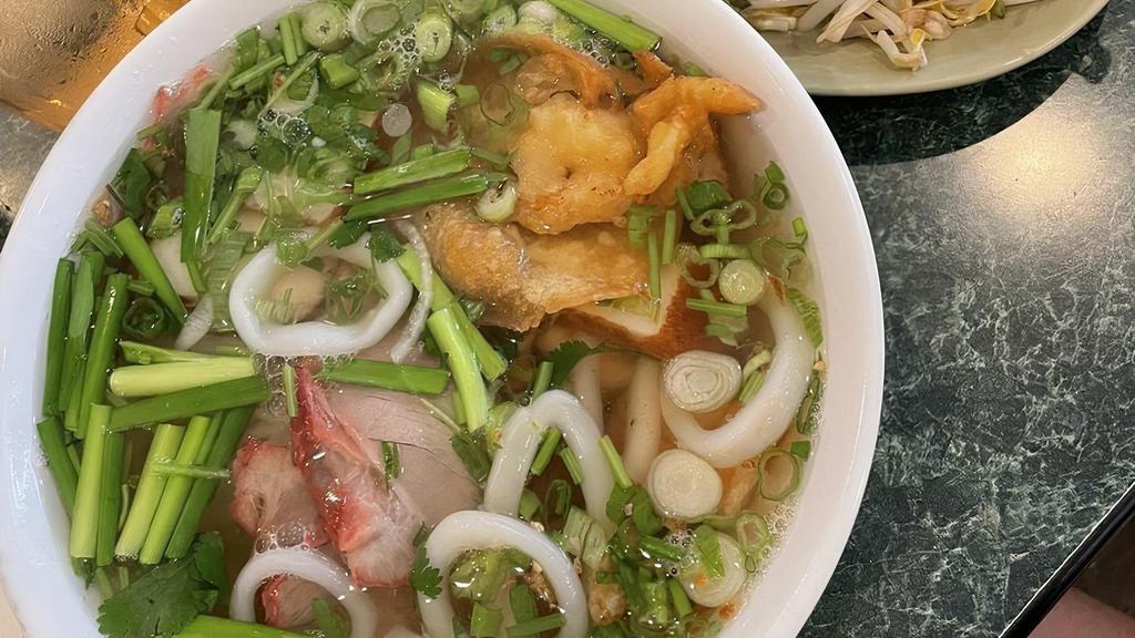 Hu Tieu Thap Cam · Rice noodle soup with sliced bbq pork, shrimp, squid, and fish cake (also available dry)
