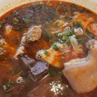 Bun Bo Hue · Spicy beef noodle soup with brisket, pork sausage, pork leg, and pork blood