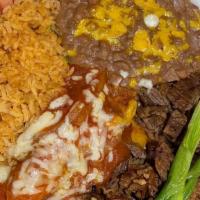 Tampiqueña · carne asada, cheese enchilada topped with ranchera sauce,refried beans,rice,sour cream,pico,...
