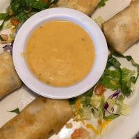 Mini Chimichangas · 4 mini chimichangas stuffed with ground beef and a side of queso