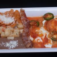Huevos Rancheros · Two over-easy eggs over a fried corn tortilla topped in ranchera sauce served with refried b...