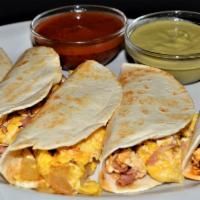 Breakfast Tacos · One scrambled egg with your choice of ham, potatoes, sausage, chorizo or a la mexicana in a ...