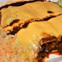 Enchiladas Texmex · Four corn tortillas filled with your choice of meat covered with chili and melted yellow che...