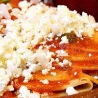 Entomatadas · Four corn tortillas filled with your choice of cheese, chicken or beef fajita. Covered with ...