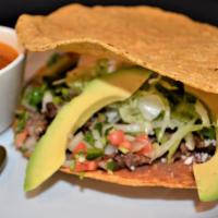 A La Mexicana · Chopped Bistec with pico de gallo, avocado, refried beans, cheese, lettuce and Mexican cream...