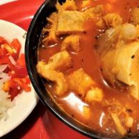 Menudo · Beef Tripe soup seasoned with red peppers and spices
