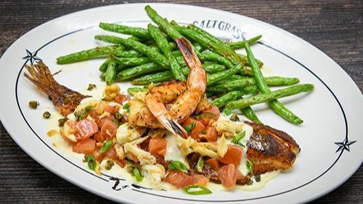 Blackened Redfish · Shrimp, crawfish, diced tomatoes, green onions, lemon butter. Served with a side & your choice of dinner Caesar salad, dinner salad (with a choice of honey-mustard, chunky bleu cheese, ranch, Thousand Island or balsamic vinaigrette), or upgrade to a wedge salad.