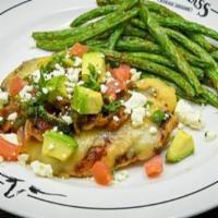 Chicken Laredo · Jack cheese, avocado, grilled onions, tomatoes, poblano peppers, cilantro, feta cheese. Serv...