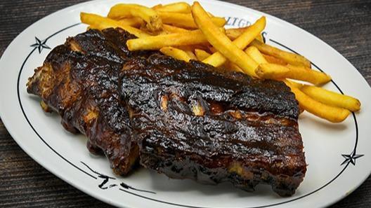 Bbq Pork Ribs · Slow-cooked & “fall-off-the-bone.” Served with a side & your choice of dinner Caesar salad, dinner salad (with a choice of honey-mustard, chunky bleu cheese, ranch, Thousand Island or balsamic vinaigrette), or upgrade to a wedge salad.