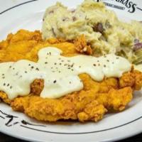 Chicken Fried Chicken · Served with a side & your choice of dinner Caesar salad, dinner salad (with a choice of hone...