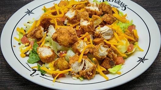 Hill Country Salad · Fried chicken, cheddar cheese, bacon, eggs, croutons, tomatoes.