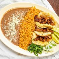 Taco Plate · Three tacos, rice, beans and meat of choice.