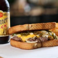 8 Oz. Corn-Fed Patty Melt · The  1/2 lb. (8oz)  Patty Melt
1/2 hamburger with grilled onions and jalapeños, melted betwe...