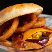 Bbq Bacon Bougie · One 1/3 lb patty topped with bacon, BBQ sauce, American cheese, and 2 onion rings.