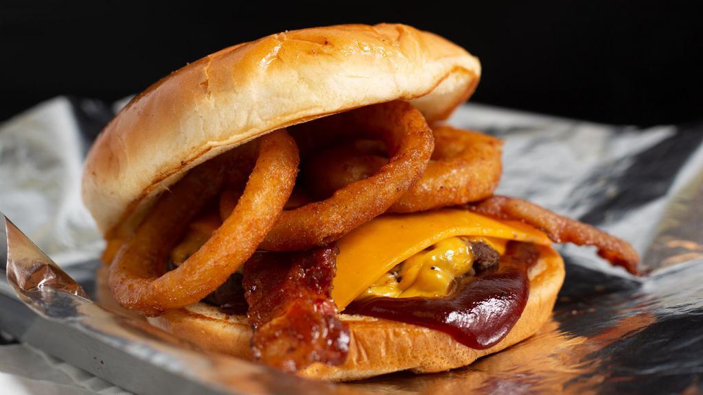 Bbq Bacon Bougie · One 1/3 lb patty topped with bacon, BBQ sauce, American cheese, and 2 onion rings.