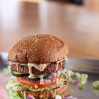 Throwing Shade Veggie · Chipotle Black Bean Veggie burger topped with lettuce, tomato, red onion and pickles on whea...