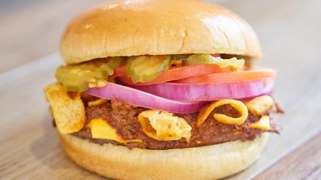Chili Cheeseburger · Mustard, pickles, tomatoes, purple onions, chili, cheese, and fritos.