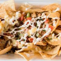 Nachos Bowl · Mound of fresh tortilla chips loaded with all your picks: rice, beans, meat, cheeses and mor...