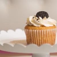Oreo · Soft vanilla cake with Oreo cookies baked into the batter, topped with buttercream frosting ...