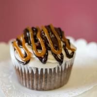 Salted Caramel Turtle Brownie · Chocolate cake drizzled with salted caramel , chocolate ganache,  topped with brownies and b...