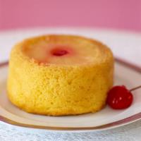 Pineapple Upside Down Cake · This classic cake, is moist and flavorful with a topping of pineapple rings and cherries.