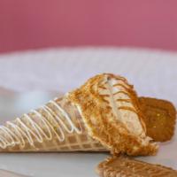 Biscoff Cookie Butter  · Waffle cone dipped in chocolate stuffed with cheesecake with biscoff cookie pieces topped wi...