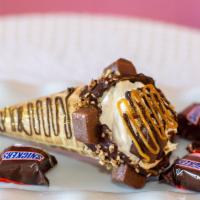 Snickers Delight  · Waffle cone dipped in chocolate covered with mini snickers and pecans, filled with snickers ...