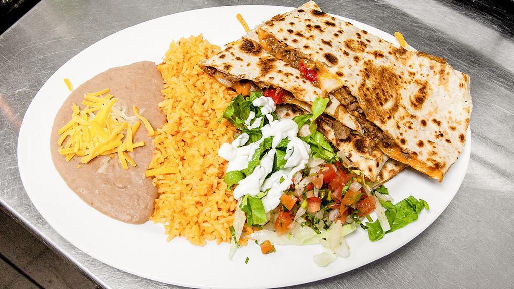 Quesadilla Plate · Your choice of meat served with cheese, onions, bell pepper, lettuce, sour cream, pico de gallo and side of rice and beans.